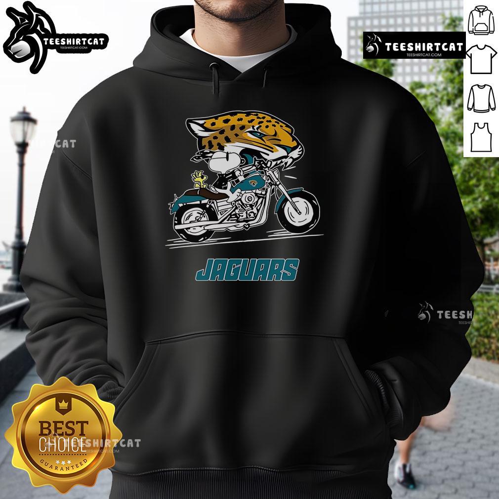 Alt Text: Official Snoopy and Woodstock driving a motorbike on Jacksonville Jaguars hoodie, perfect for NFL fans.