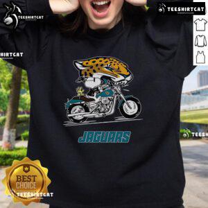 Alt Text: Official Snoopy and Woodstock driving motorbike on Jacksonville Jaguars sweatshirt, perfect for fans and collectors.