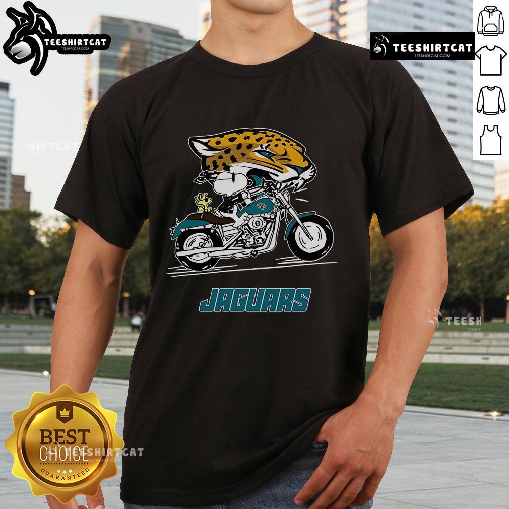 Alt Text: Official Snoopy and Woodstock driving motorbike on Jacksonville Jaguars T-Shirt design for fans.