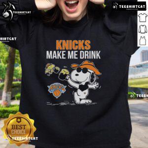 Alt Text: Official Snoopy and Woodstock New York Knicks Make Me Drink sweatshirt featuring vibrant graphics and cozy design.