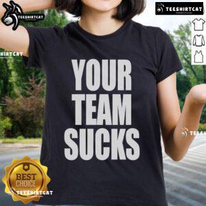 Official Your Team Sucks Ladies Tee featuring bold graphics and a stylish design for sports fans and casual wear.