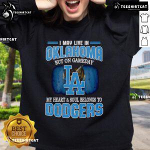 Premium sweatshirt with 'I May Live In Oklahoma But On Gameday My Heart Belongs To Dodgers' design, perfect for fans.