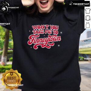 Cozy 'Pretty Won't You Take Me To Finneytown' sweatshirt displayed on a wooden background, perfect for casual wear.