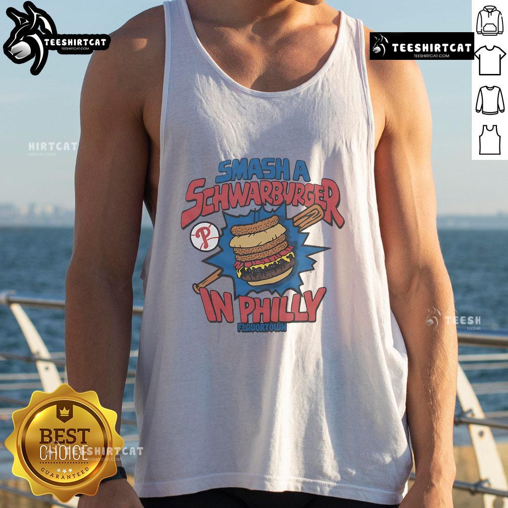 Philadelphia Phillies fan wearing a Good MLB X Flavortown tank top while enjoying a Schwarburger in Philly.