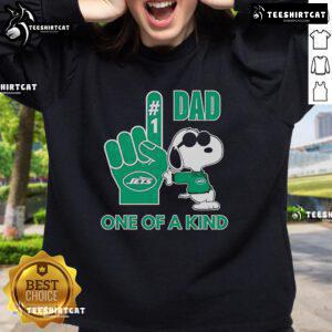 Happy Snoopy wearing a New York Jets sweatshirt, showcasing a unique DAD design for football fans.