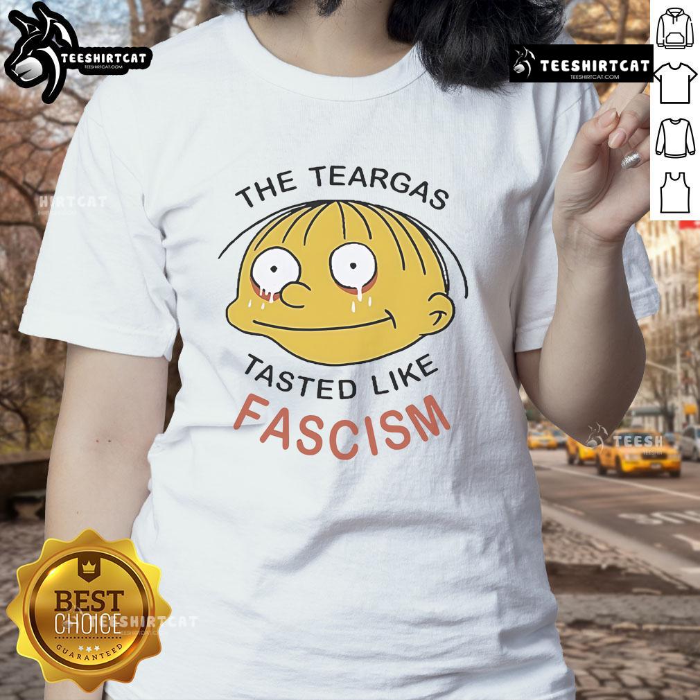 Official Ralph Wiggum 'The Teargas Tastes Like Fascism' Ladies Tee featuring a playful graphic and vibrant colors.