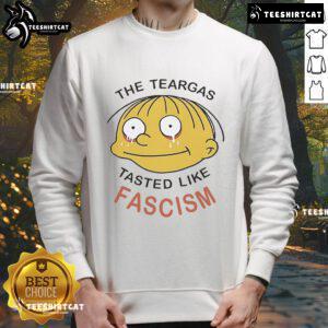 Official Ralph Wiggum sweatshirt featuring 'The Teargas Tastes Like Fascism' design, perfect for fans of The Simpsons.