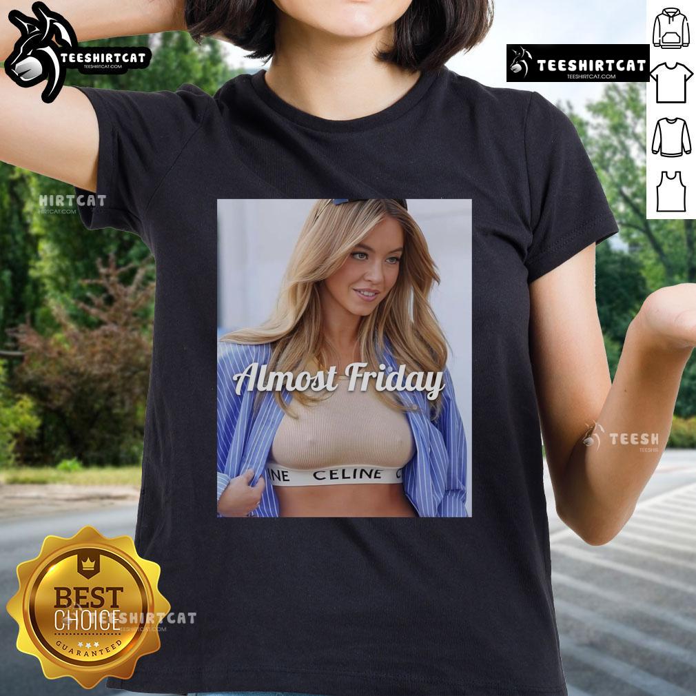 Sydney Sweeney wearing Celine crop top in Almost Friday ladies tee, showcasing trendy fashion style.