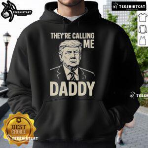 Alt Text: Official Trump 'Theyre Calling Me Daddy' hoodie featuring bold text and a stylish design, perfect for supporters.