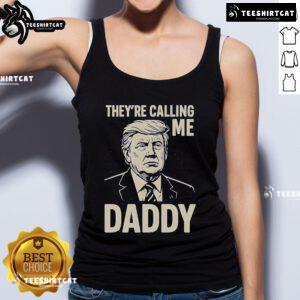 Alt Text: Official Trump 'They're Calling Me Daddy' Tank Top featuring bold text design, perfect for casual summer wear.
