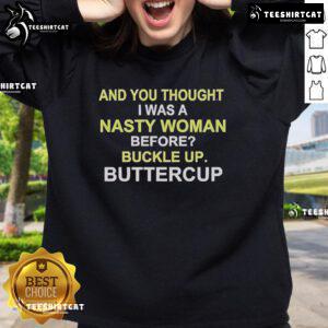 Alt Text: Whoopi Goldberg wearing the You Thought I Was A Nasty Woman? Buckle Up, Buttercup! sweatshirt.
