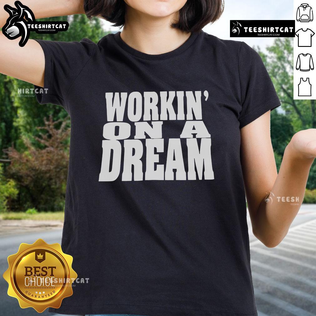 Official 'Workin On A Dream' ladies tee featuring a stylish design, perfect for casual wear and fan merchandise.