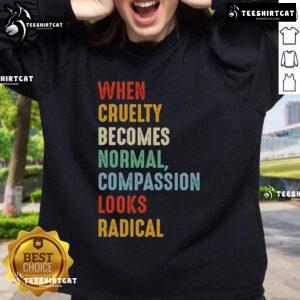 Original 'When Cruelty Becomes Normal, Compassion Looks Radical' sweatshirt displayed on a neutral background.