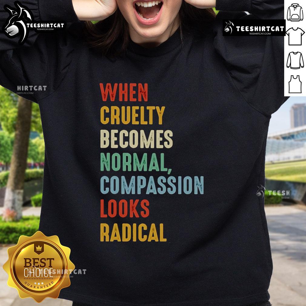 Original 'When Cruelty Becomes Normal, Compassion Looks Radical' sweatshirt displayed on a neutral background.