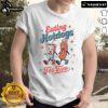 Couple wearing 'Nice Eating Hotdogs For Two' T-Shirt, enjoying hotdogs at a picnic, perfect for food lovers.