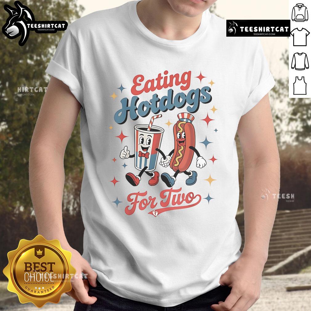 Couple wearing 'Nice Eating Hotdogs For Two' T-Shirt, enjoying hotdogs at a picnic, perfect for food lovers.