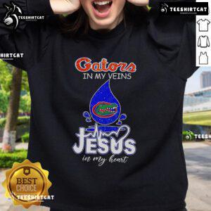 Nice Florida Gators in My Veins Jesus in My Heart sweatshirt featuring vibrant colors and bold lettering.