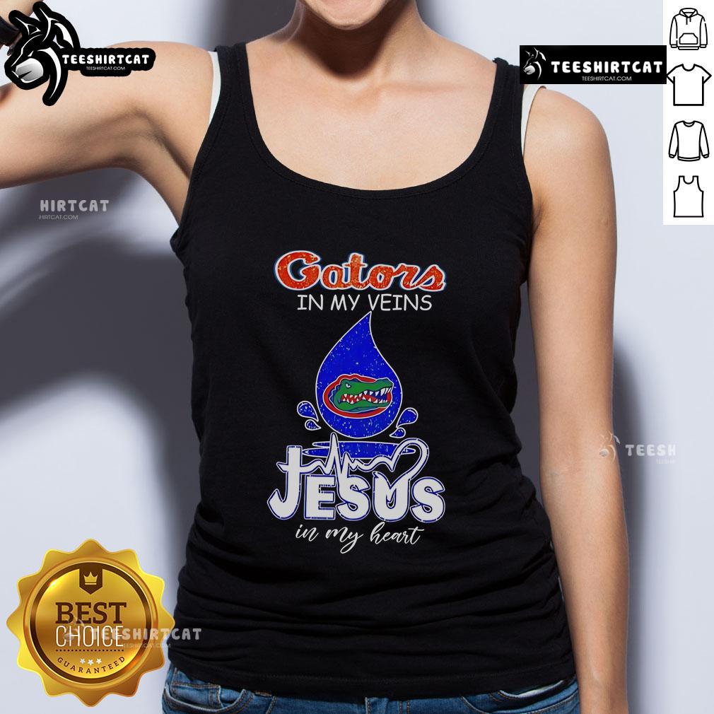 Nice Florida Gators in My Veins Jesus in My Heart tank top showcased on a model, perfect for Gators fans and casual wear.