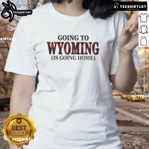 Stylish ladies tee with 'Going to Wyoming is Going Home' graphic, perfect for proud Wyoming enthusiasts.