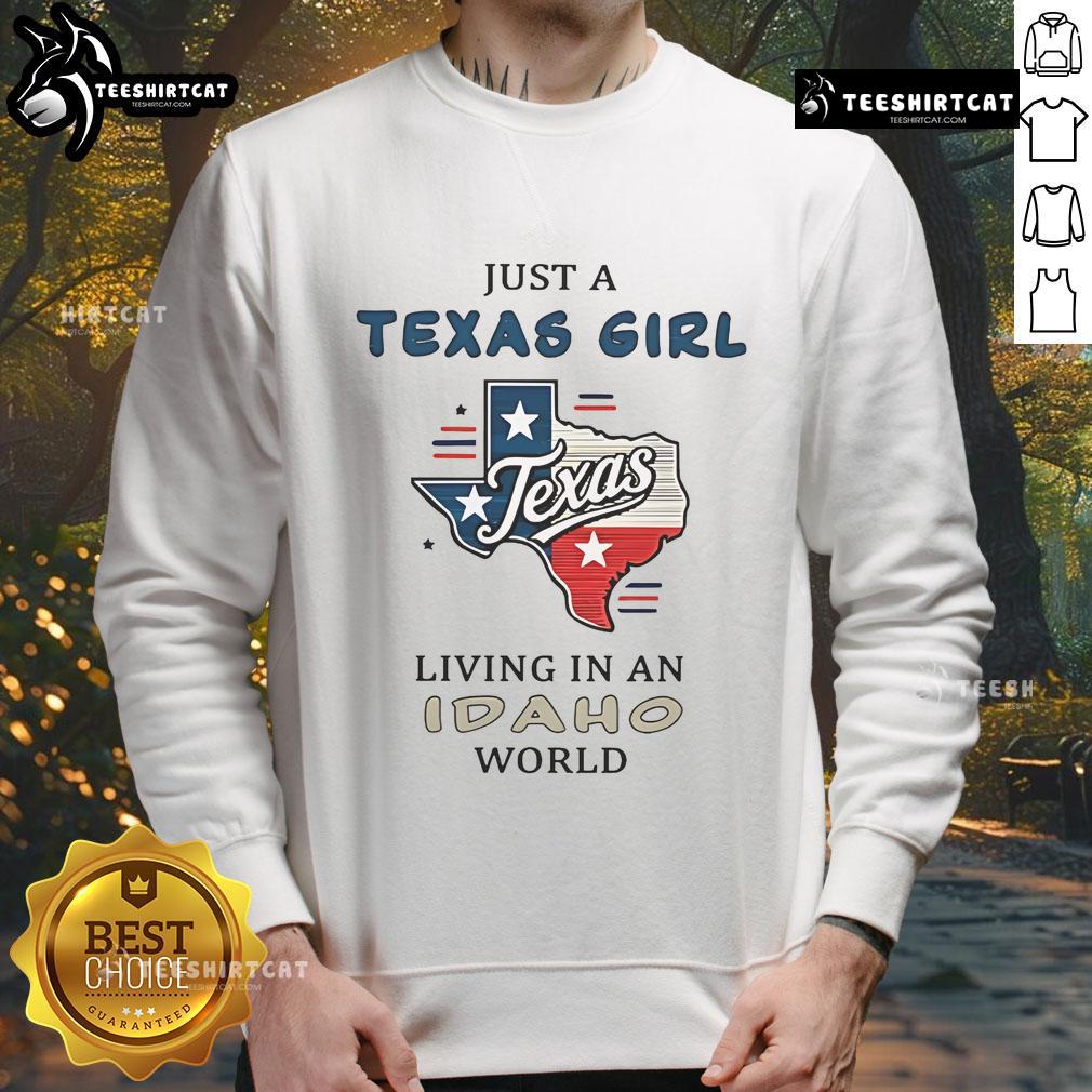 Woman wearing a 'Nice Just A Texas Girl Living In An Idaho World' sweatshirt, showcasing a blend of Texas and Idaho culture.