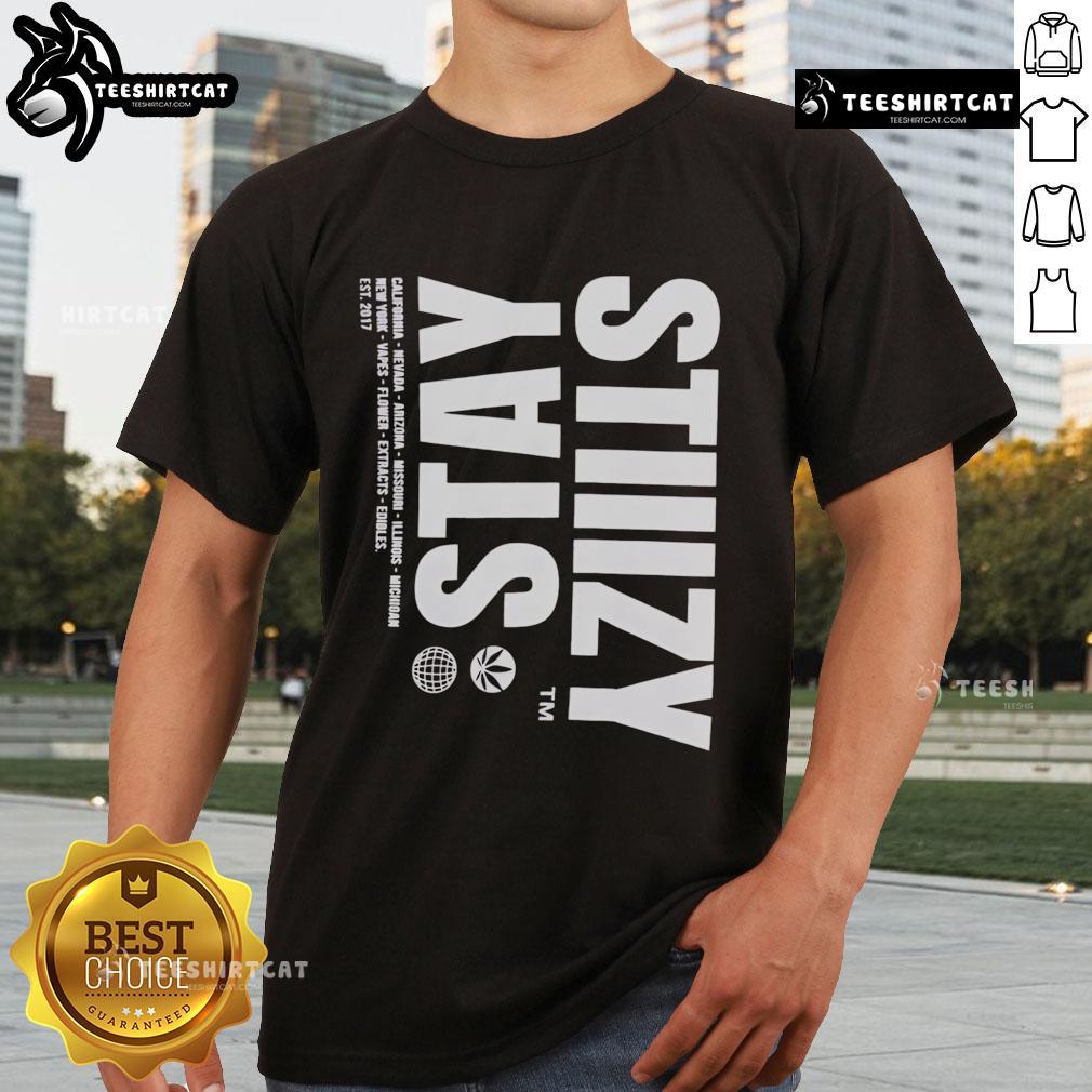 Alt Text: Stylish Nice Stiiizy Pursuit Of Excellence T-Shirt displayed on a hanger, perfect for casual streetwear fashion.