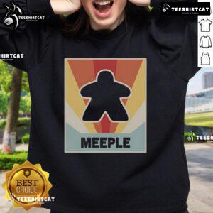 Cozy vintage MEEPLE board game sweatshirt featuring colorful game pieces, perfect for board game enthusiasts.
