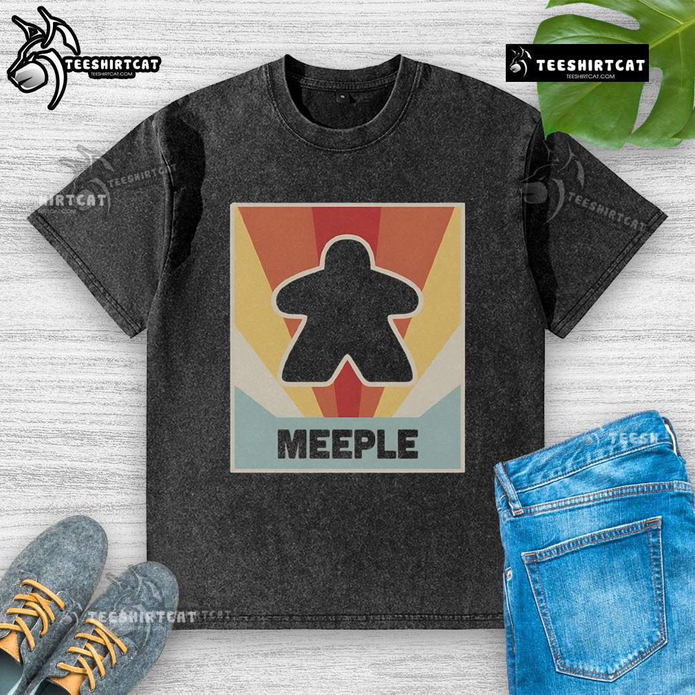 Vintage Meeple board game washed t-shirt featuring colorful game pieces design, perfect for board game enthusiasts.