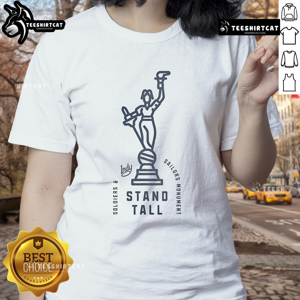 Women in stylish tees stand proudly by the Soldiers and Sailors Monument in Indianapolis, highlighting a nice visit to Indy.