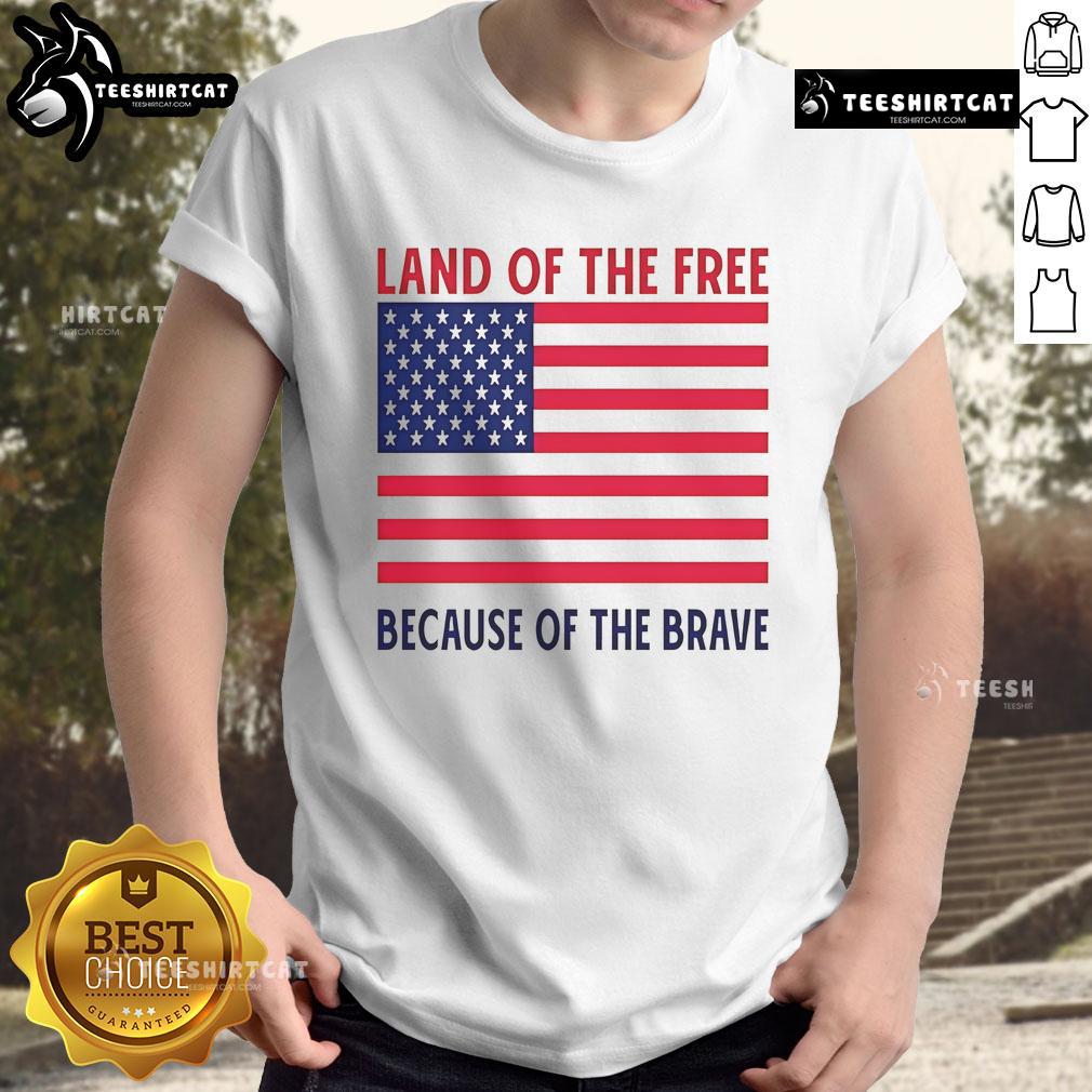 Vivek Ramaswamy smiling in a Land of the Free Because of the Brave T-shirt, promoting patriotism and freedom.