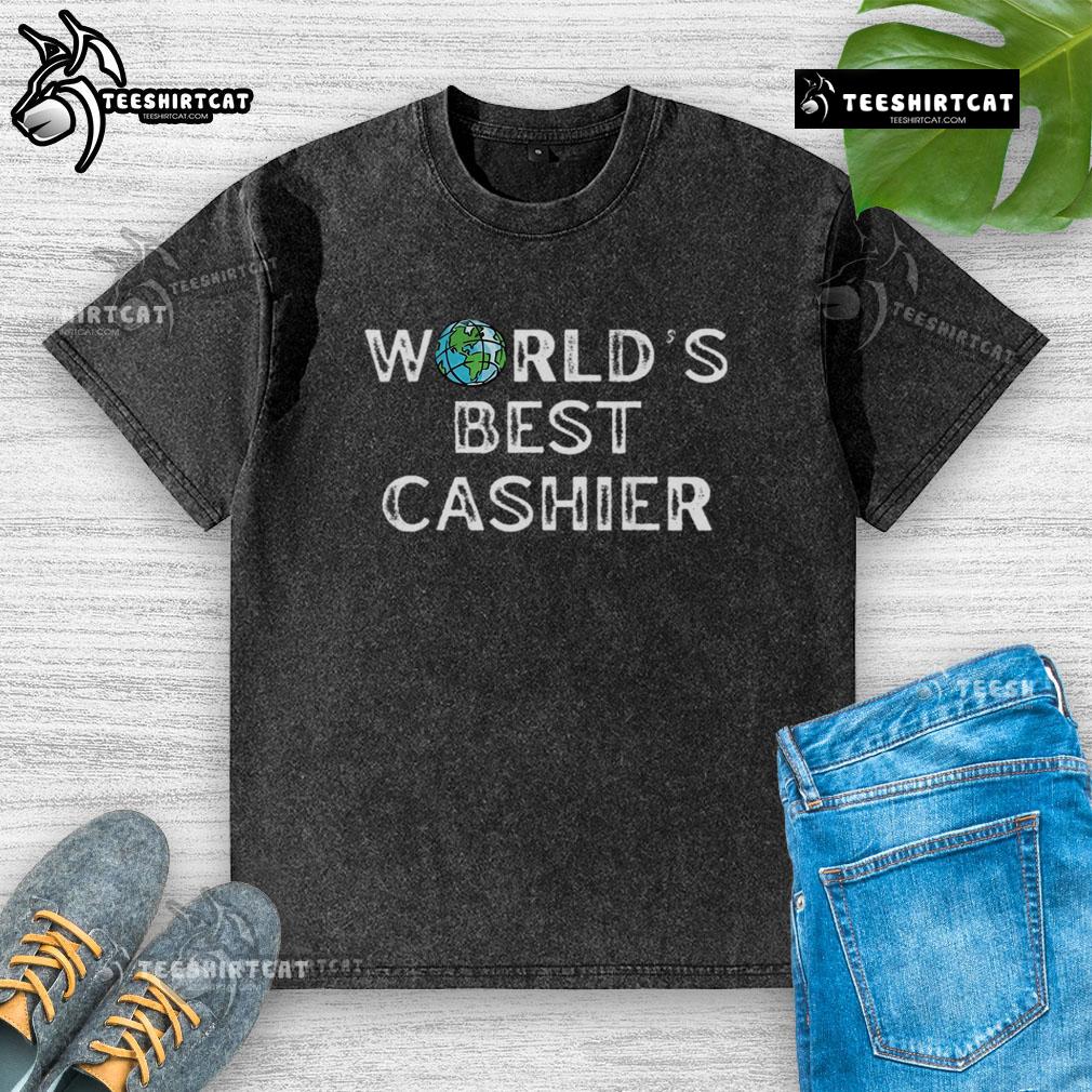 Nice Worlds Best Cashier washed t-shirt displayed on a wooden background, showcasing its soft fabric and vibrant print.