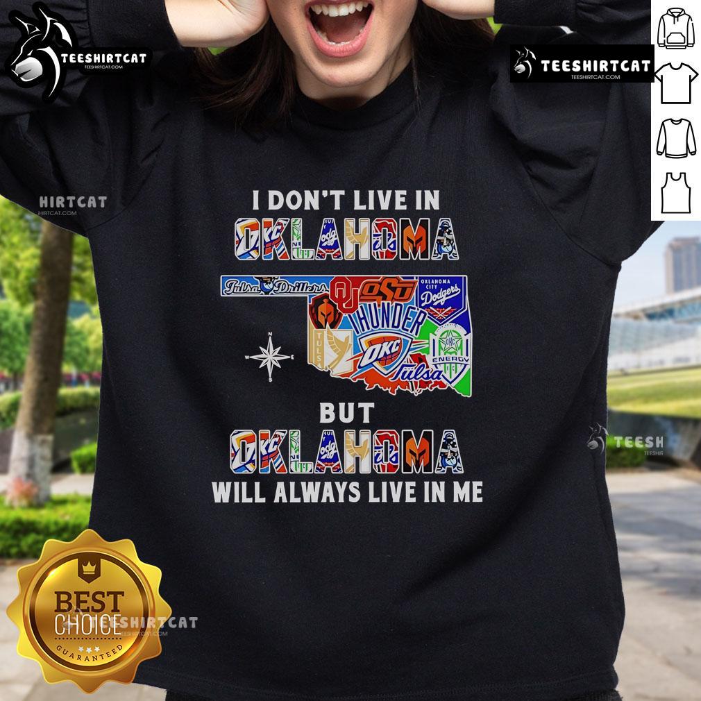 Official 'I Dont Live in Oklahoma but Oklahoma Will Always Live in Me' sweatshirt featuring sport teams logo and design.