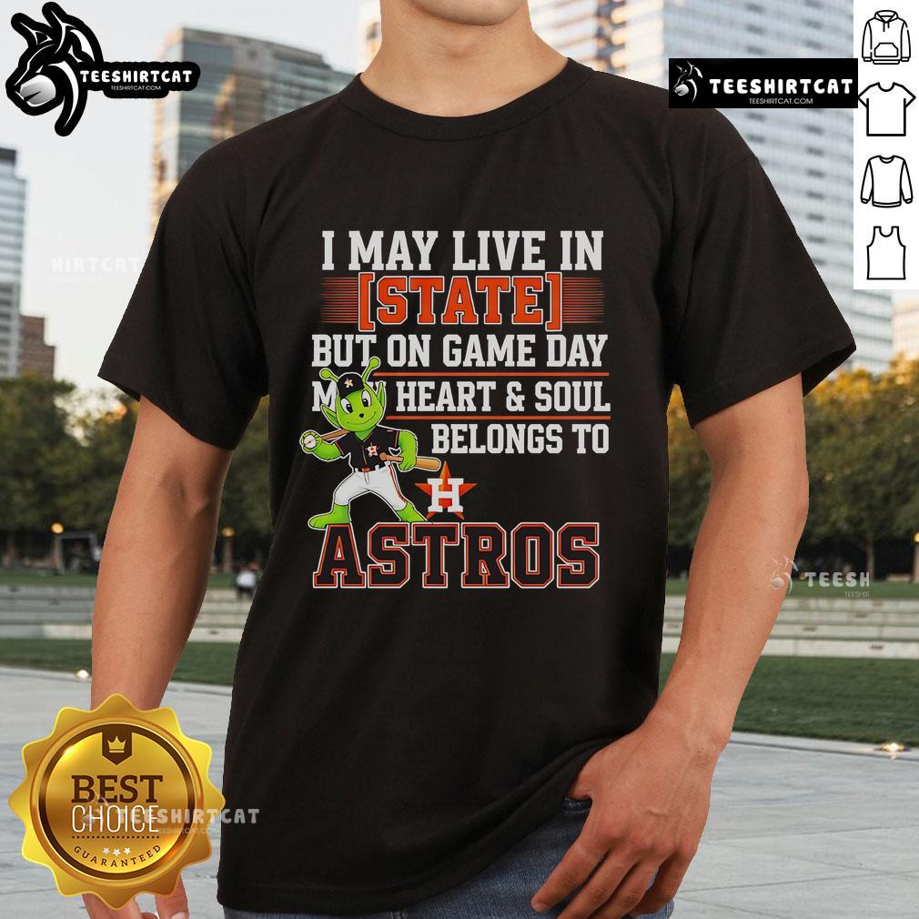 Official I May Live In State But On Game Day My Heart And Soul Belongs To The Houston Astros T-Shirt displayed on a hanger.