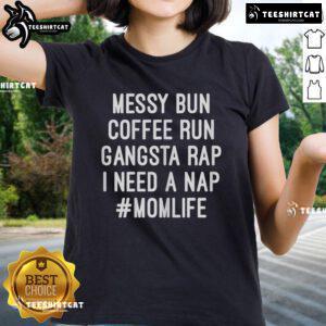 Mom wearing 'I Need A Nap' tee with messy bun, enjoying coffee during a busy day, perfect for mom life and casual style.