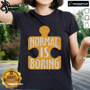 Official Normal Is Boring Puzzle Piece Autism Awareness Ladies Tee featuring colorful puzzle design on a soft fabric.