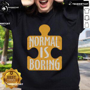 Official Normal Is Boring Puzzle Piece Autism Awareness Sweatshirt in vibrant colors promoting autism acceptance.