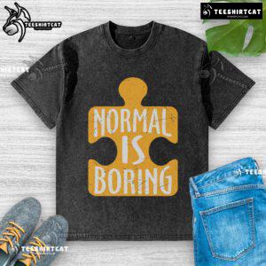 Official Normal is Boring Puzzle Piece Autism Awareness Washed T-Shirt showcasing vibrant design promoting autism acceptance.