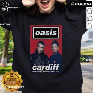 Alt Text: Official Oasis Cardiff Principality Stadium July 4, 2025 poster design on a stylish sweatshirt for concert fans.