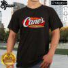Alt Text: Official Raising Cane's Chicken Fingers T-Shirt featuring bold logo design and vibrant colors for fans and food lovers.