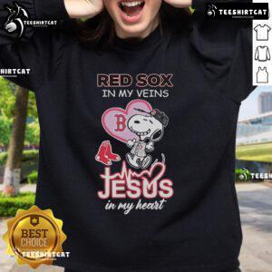 Alt Text: Official Snoopy Boston Red Sox sweatshirt featuring In My Veins, Jesus In My Heart design, perfect for fans.