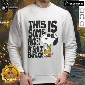 Official Snoopy sweatshirt featuring the phrase 'This Is Some Fucked Up Shit Bro' in a playful design.