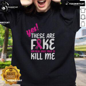 Stylish Breast Cancer Awareness sweatshirt with 'Yes, these are fake' slogan, promoting awareness and support for survivors.