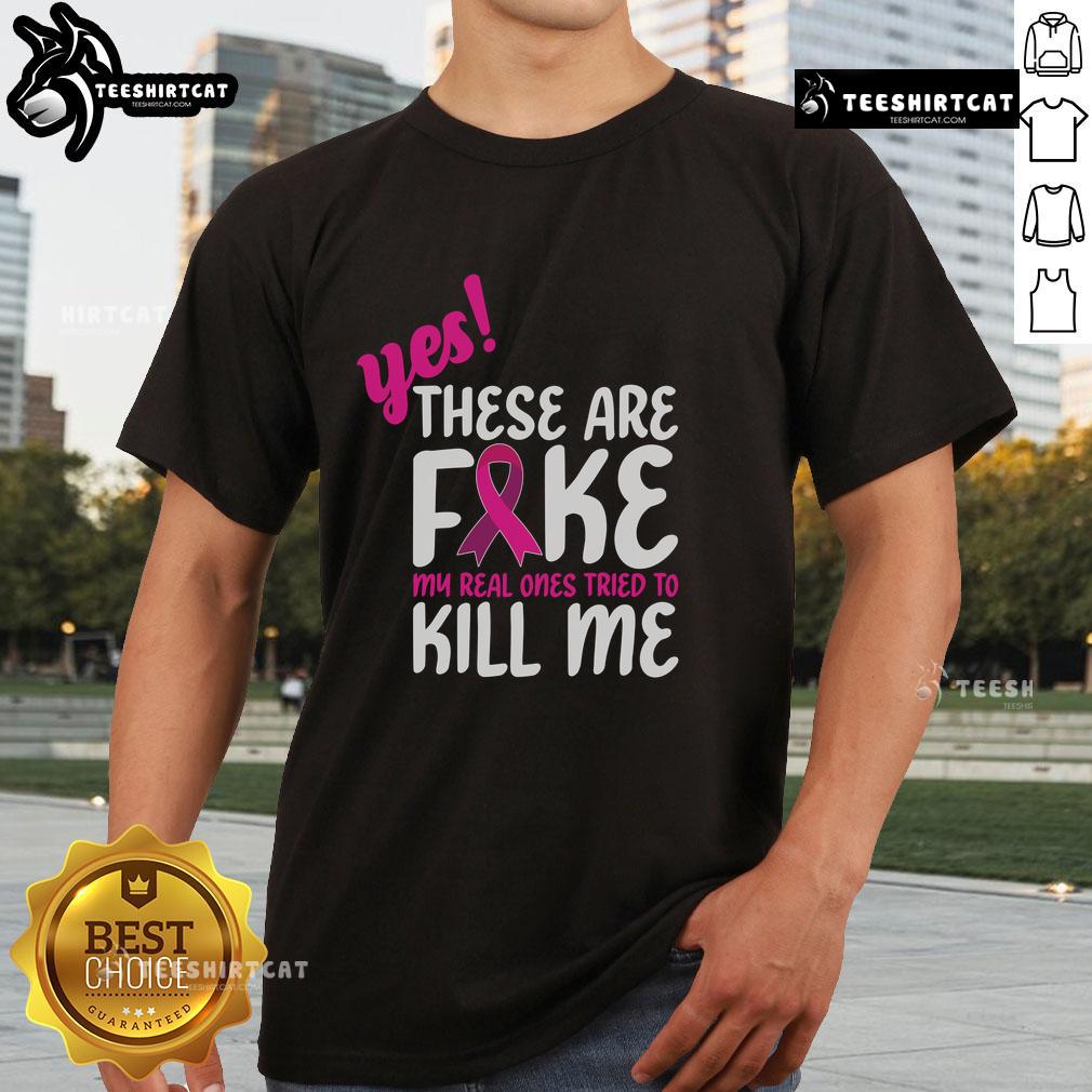 Official Yes These Are Fake My Real One Tried To Kill Me Breast Cancer Awareness T-Shirt featuring bold pink graphics.