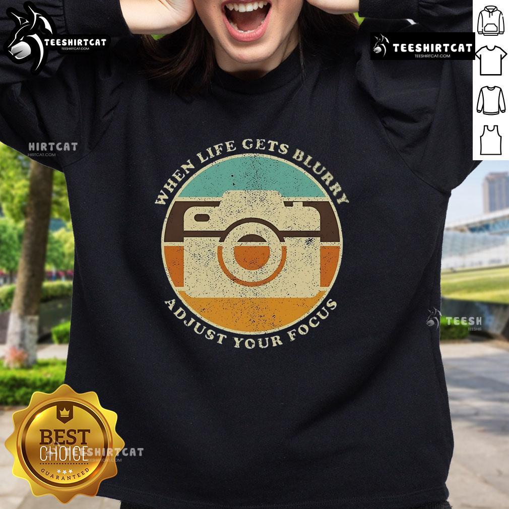 Alt Text: Vintage camera quote sweatshirt featuring When Life Gets Blurry, Adjust Your Focus design for photography lovers.