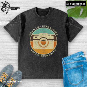 Vintage camera quote on a washed T-shirt: 'When life gets blurry, adjust your focus.' Perfect for photography lovers.