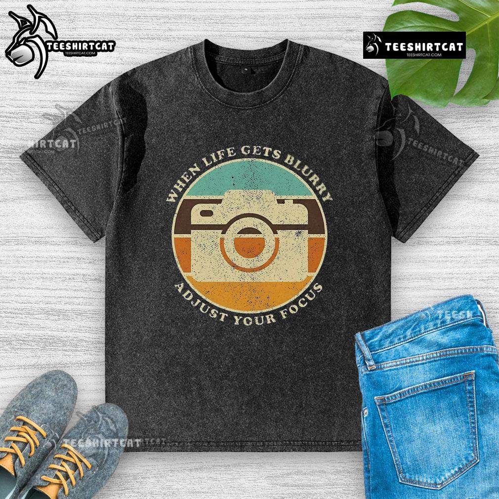 Vintage camera quote on a washed T-shirt: 'When life gets blurry, adjust your focus.' Perfect for photography lovers.