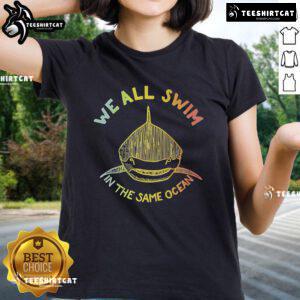 Premium 'We All Swim in the Same Ocean' Pride Ladies Tee featuring vibrant colors and a stylish design celebrating inclusivity.