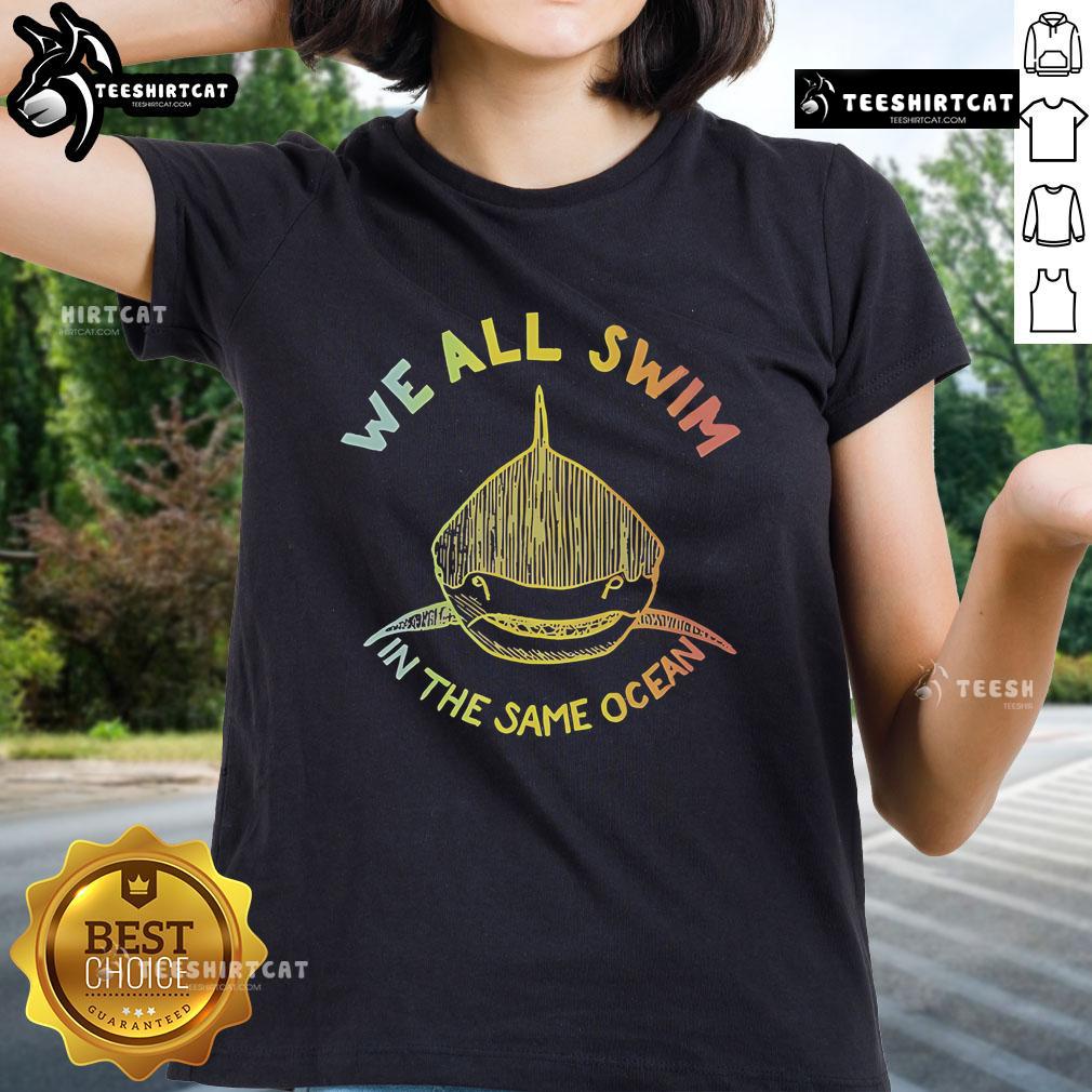 Premium 'We All Swim in the Same Ocean' Pride Ladies Tee featuring vibrant colors and a stylish design celebrating inclusivity.