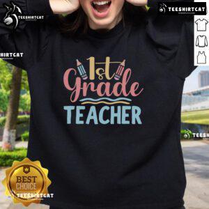 Pretty 1st grade teacher sweatshirt featuring a colorful design, perfect for educators and classroom style.