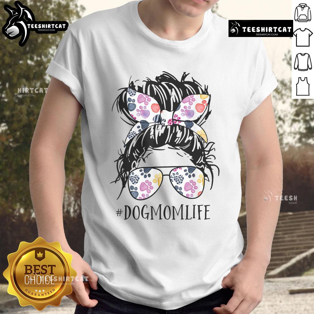 Pretty dog mom wearing a messy bun hairstyle, celebrating Mother's Day in a stylish animal-themed T-shirt.