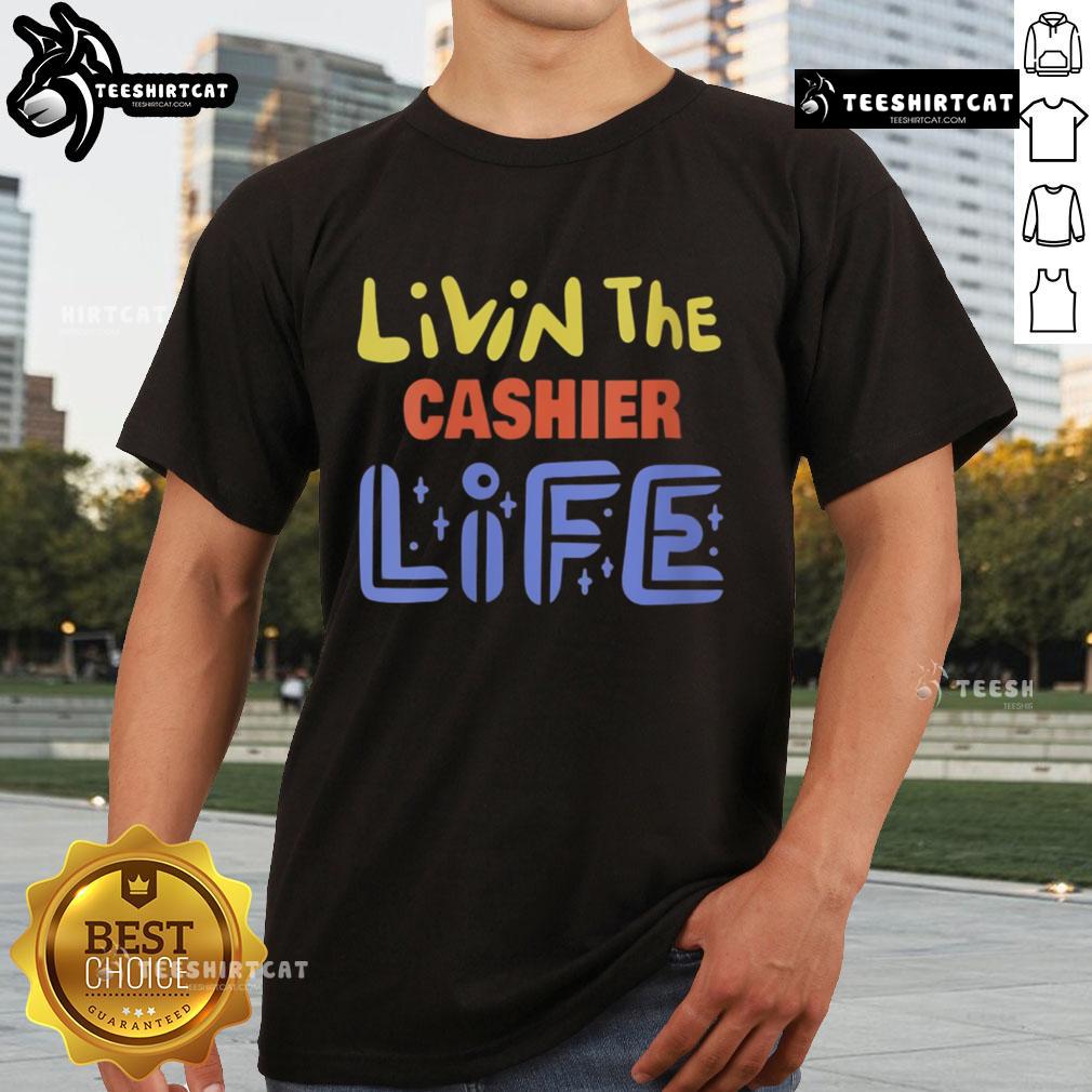 Alt Text: Pretty Livin The Cashier Life T-Shirt featuring a stylish design for cashiers and retail workers.